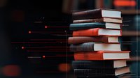 Stack of hardcover books with glowing red light particles floating in dark atmospheric setting, creating magical educational ambiance. Knowledge concept for learning.