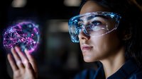 Young Asian woman in protective glasses examining glowing purple holographic molecular structure floating above her hand in dark laboratory setting.