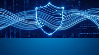 Digital shield symbol with flowing light trails on blue technology background for cybersecurity and data protection concepts.