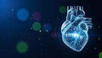 Digital wireframe human heart with glowing particles on dark blue background for medical technology and healthcare innovation concepts.