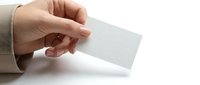 Professional hand holding blank white business card mockup on clean background for corporate branding and marketing design presentations.