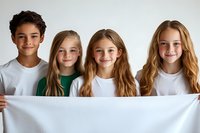 Diverse group of children holding blank white banner against light background, smiling and looking at camera. Great for education or youth concepts.