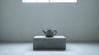 Minimalist gray ceramic teapot on a concrete pedestal in a neutral studio setting, evoking calm, simplicity, and modern design aesthetics.