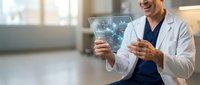 Smiling male doctor in white coat examining futuristic holographic medical data display in modern hospital setting with advanced healthcare technology.