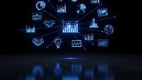 Business analytics holographic interface with glowing blue data visualization icons, charts and graphs floating above conference table for presentations.