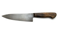 Vintage chef knife with worn steel blade and wooden handle isolated on white background for culinary design projects and kitchen equipment concepts.