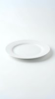 Empty white ceramic dinner plate on clean white background for kitchen and dining room design projects.