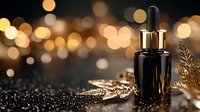 Black glass dropper bottle with golden leaf decoration against blurred bokeh lights background creates luxurious cosmetic product scene for beauty industry advertising.