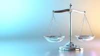 Metallic scales of justice on gradient background with soft lighting effects, symbolizing law, balance and fairness in legal proceedings and judicial system.