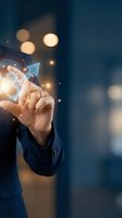 Businessman in dark suit holding glowing digital arrow and gear icons, representing growth, success, and business strategy for corporate and technology concepts.