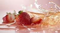 Fresh ripe strawberries with dynamic water splash creating energetic motion, droplets floating in air against soft pink background. Perfect for beverage advertising.