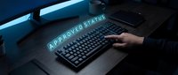 Programmer hand typing on mechanical keyboard with approved status hologram glowing above desk in dark office workspace for technology and business concepts.
