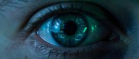 Close-up of a human eye with striking blue iris displaying digital circuit patterns and technology reflections, symbolizing artificial intelligence, digital vision, and futuristic innovation.