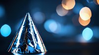 Party hat with silver metallic surface reflecting blue and orange bokeh lights in dark background, festive celebration mood with blurred glowing circles.