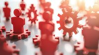 Red silhouettes of people and gears symbolizing teamwork and business processes against blurred background, representing collaboration and organizational structure.