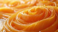 Fresh raw salmon sashimi slices arranged in rose pattern, close up macro shot showing delicate texture and vibrant orange color of premium fish fillet.