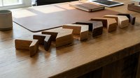 Wooden carpenter tools chisels set arranged on workbench in workshop for woodworking craftsmanship and traditional handmade furniture making projects.