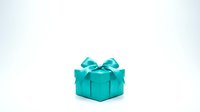 Turquoise gift box with bow isolated on white background, ready for holiday, birthday, and celebration design projects.
