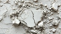 Cracked and peeling white paint texture on weathered surface showing age and deterioration with rough flaking layers for backgrounds and design projects.