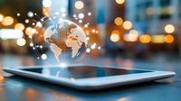 Digital globe hologram floating above tablet screen with network connections in modern city bokeh lights background for global business technology concepts.