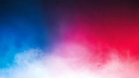 Vibrant gradient background with ethereal clouds blending from deep blue to hot pink, creating dramatic atmospheric effect for modern design projects.