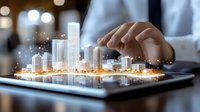 Professional hands working on digital tablet displaying glowing futuristic cityscape hologram with illuminated buildings and modern architecture for urban development concept.