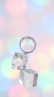 Holographic crystal geometric shapes floating on iridescent rainbow gradient background for modern design projects and digital art applications.