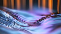 Flowing liquid surface with vibrant blue and purple colors creating dynamic waves and ripples against warm orange light background, macro photography.