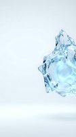 Transparent crystalline ice chunk with sharp facets and light blue tones isolated on white background, suitable for beverage, cooling, and design projects.