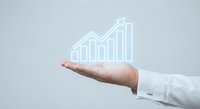 Business professional hand presenting holographic growth chart with upward arrow showing financial success and data analytics for corporate presentations.