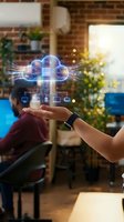 Hand holding a glowing cloud computing hologram with network nodes in a modern office, representing digital infrastructure and data storage technology.
