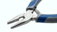 Professional needle nose pliers with blue ergonomic handles and textured grips isolated on white background for tool and hardware projects.