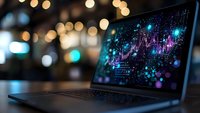 Modern laptop displaying colorful data visualization charts and analytics dashboard on screen with bokeh lights background for business presentations.