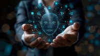Digital hologram of human face with network connections and technology icons floating above cupped hands against dark background with bokeh lights.