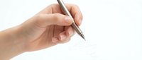 Hand holding black pen ready to write on white paper background for business documentation and office work.