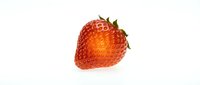Fresh ripe strawberry with green leaves isolated on white background, ready for food and beverage design projects.