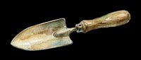 Vintage garden trowel with wooden handle isolated on transparent background, ready for gardening clipart, print-on-demand designs, and sublimation projects.