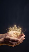 Cupped hands holding glowing golden light figures representing teamwork, community support, and human connection on dark background.