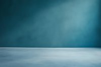 Minimalist teal blue gradient background with light beam effect and empty gray floor, ideal for product photography or digital compositions.