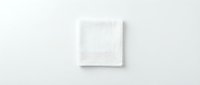 Folded white cotton muslin cloth isolated on white background, soft textured fabric square for mockup, packaging, and home textile design use.