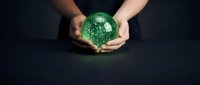 Hands holding glowing green globe with digital network connections, representing global technology, sustainability, and environmental innovation for business concepts.