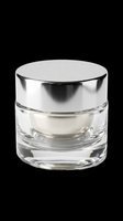 Luxury cosmetic jar with silver metallic lid isolated on transparent background, ready for skincare product packaging, beauty branding, print-on-demand designs, and e-commerce applications.