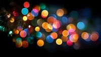 Colorful bokeh lights creating magical atmosphere with warm and cool tones blending together on dark background for festive holiday celebrations.