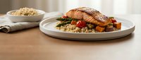 Grilled salmon fillet with quinoa and roasted vegetables on white plate, healthy dinner meal for restaurant menu and food photography.
