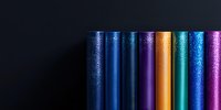 Vertical metallic columns with sparkling glitter falling effect in vibrant blue, purple, gold, and turquoise colors against dark background, creating modern abstract design.