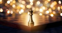 Golden chess king piece standing on wooden chessboard with warm bokeh lights creating strategic leadership and success concept for business presentations.