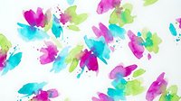 Vibrant watercolor flower splashes in magenta, cyan, and lime green with organic ink blotches on white background, isolated design element for digital and print projects.