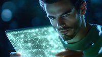 Young bearded man looking at glowing holographic display with digital particles in dark room, futuristic technology concept for business innovation.