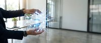Businesswoman holding digital globe hologram in modern office environment, representing global connectivity, international business, and technology innovation.