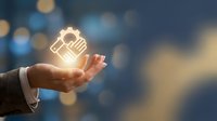 Worker holding glowing light bulb icon in palm against blurred bokeh background, representing innovation, ideas, and creative business solutions for corporate design.